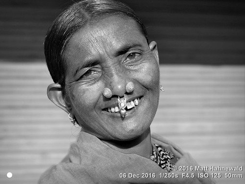 photo physiognomy psychological primelens street portrait closeup tiltedhead monochrome cultural character nose nosepiercing bareheaded blanket consent respect emotion fun posing authentic smiling laughing happy cheerful softfocus eyes adivasi matthahnewaldphotography face facingtheworld blackandwhite nosejewelry horizontal head india jeypore woman nikond3100 nosestud orissa outdoor market 50mm oneperson expression headshot nikkorafs50mmf18g fullfaceview 1200x900pixels resized lookingatcamera