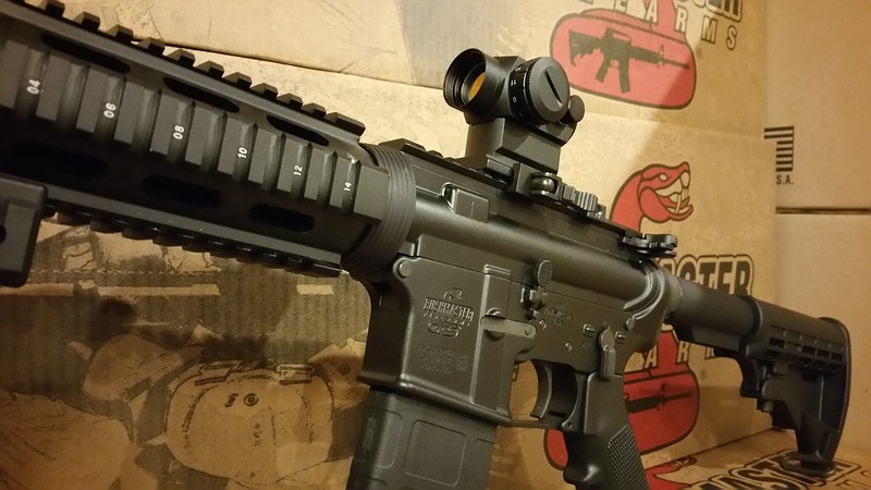 Bushmaster with Red Dot & 45 Degree Sights WWW.USAFIREARMS.COM