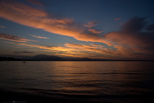 sonyslta99 sal2470z earlymorning sun sunrise light clouds color lake water lakegarda lagodigarda italy