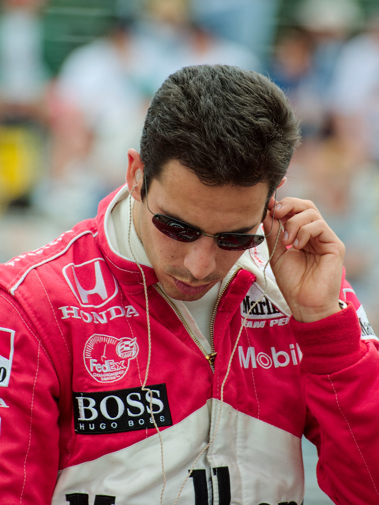 Helio Castroneves prepares to climb aboard his Team Penske racing car at the CART race at Portland International Raceway in 2001