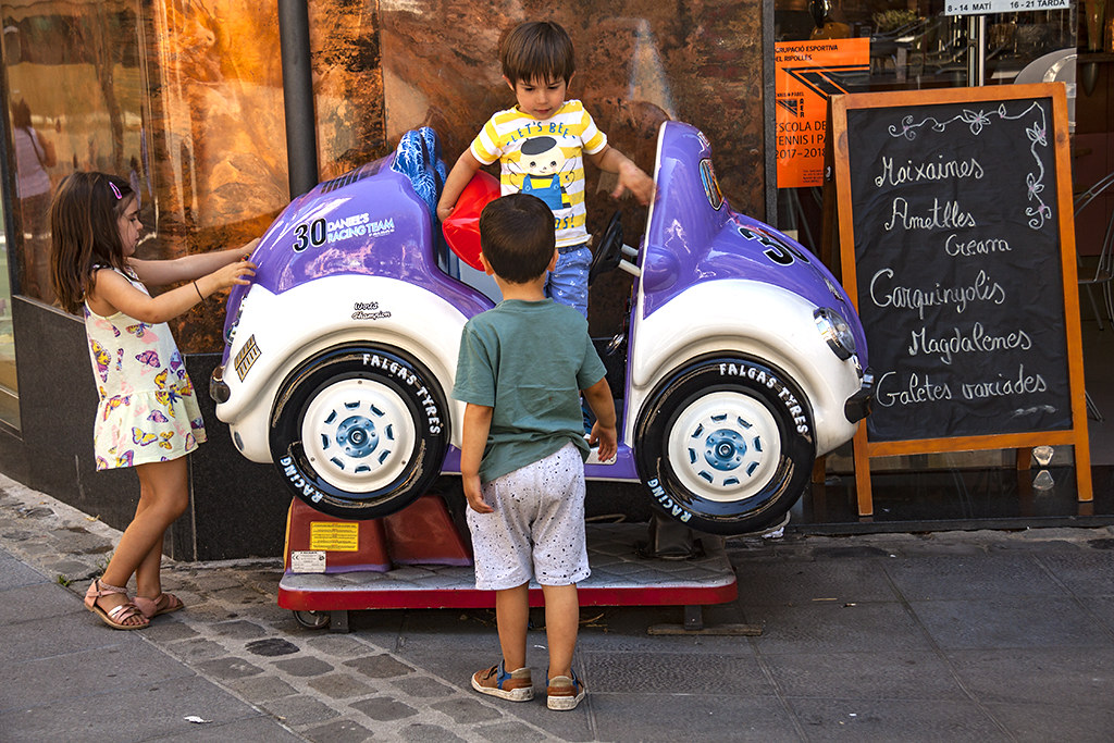 Three kids with a amusement car--Ripoll