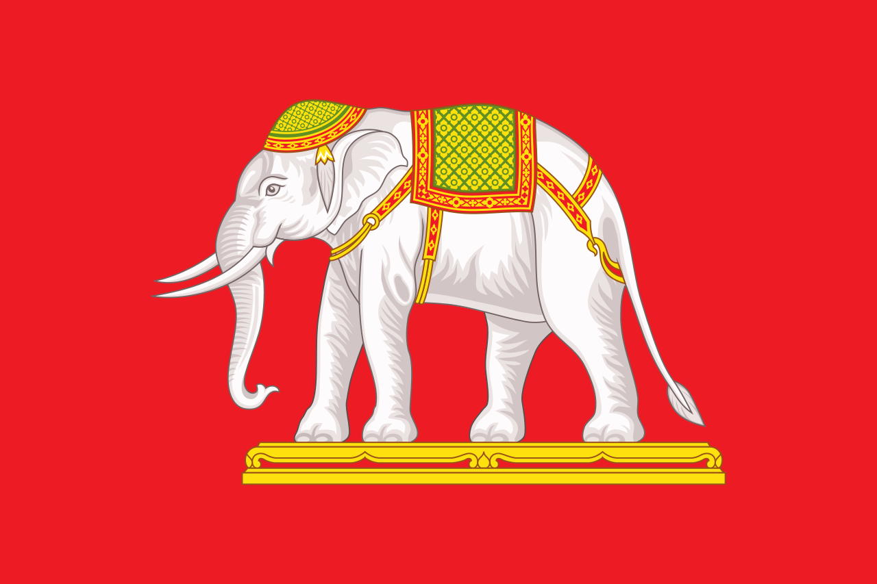 State flag of Siam. Used as the Siamese Naval Ensign from 1887, 1910, this was used as the state flag between 1916-1917. It features dressed white elephant on red background, facing a flagpole. ไทย: ธงราชการสยาม สมัยรัชกาลที่ ๖