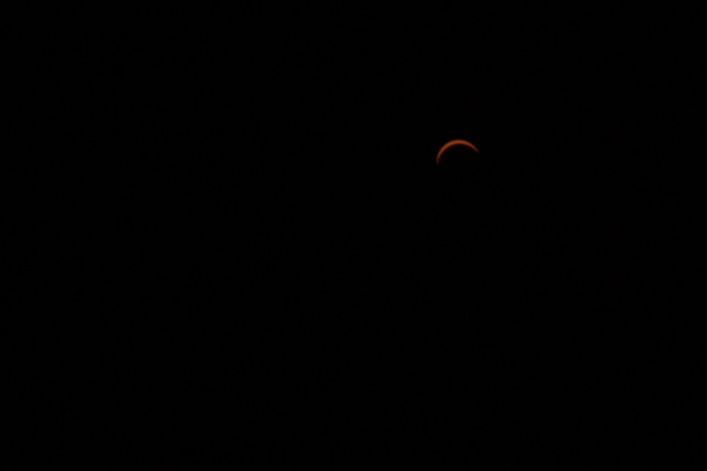 Scarlet crescent. Partial solar eclipse at maximum. Copyright 2017 Jonny Eberle.