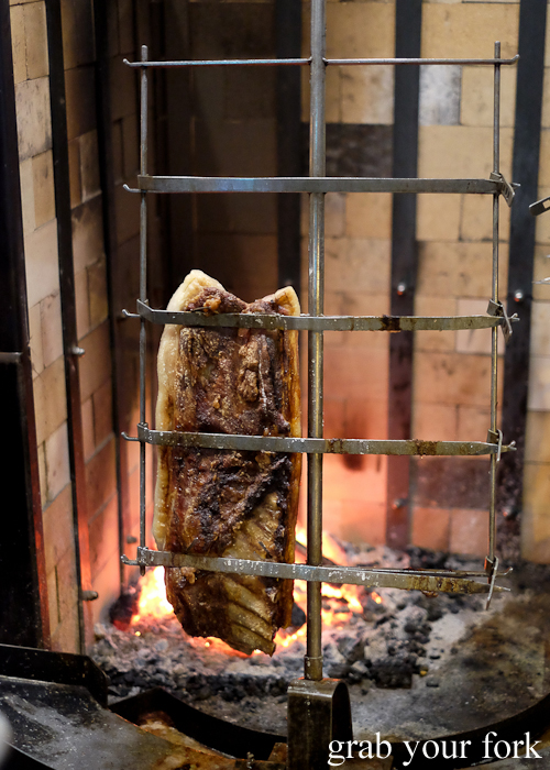 Wood-fired pork belly at Porteno in Surry Hills