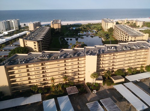 siesta key sarasota florida condominium gulf and pay club palm trees pond beach ocean sunrise