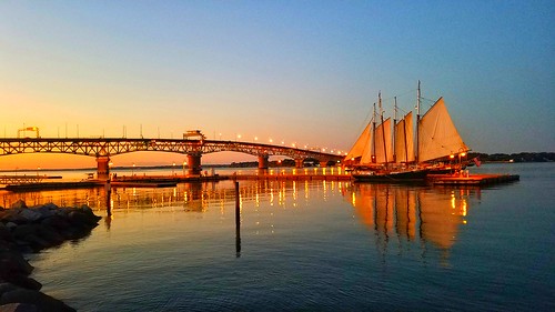 sailboat sunset bridge river