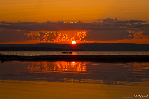 lakeainslie sunset boat reflection clouds lake water calm capebreton