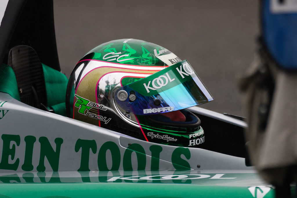Paul Tracy waits in the pits while his crew makes adjustments to his car during Saturday practice at the 2002 CART race at Portland International Raceway