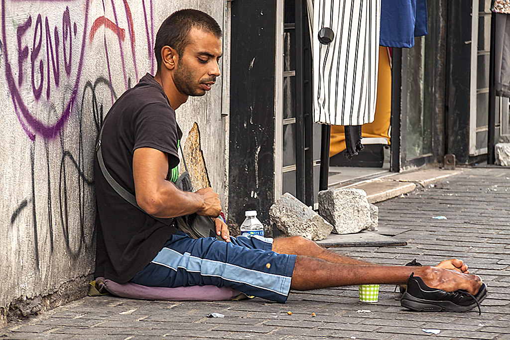 Beggar with deformed legs--Marseille