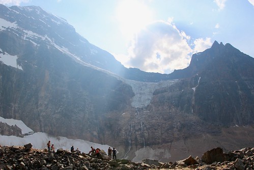jasper alberta mountain glacier partlycloudy sun glare hiker people alpine