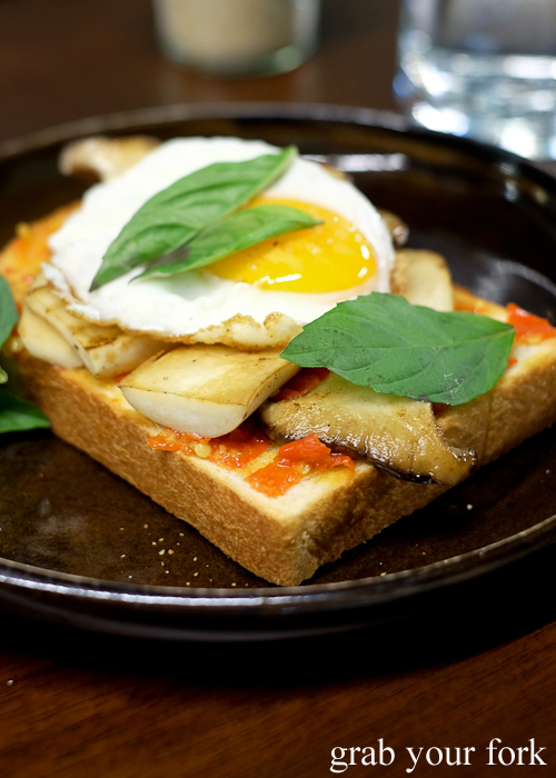 Chilli and mushroom with fried egg on potato bread at Paper Bird in Potts Point