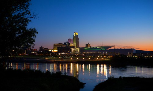 ne nebraska omaha sunset evening dusk city downtown buildings vivid peaceful river urban bridge lights