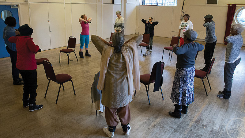 A group of older people take part in a session of physical activity