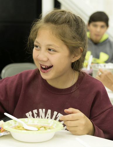Emilee Wilson is all smiles - and blueberry jam - as she enjoys the meal she helped make.