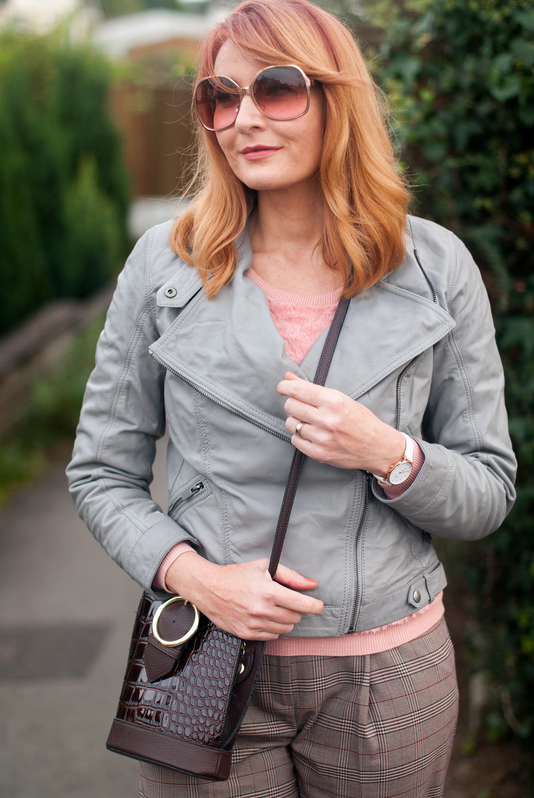 Smart but comfy autumnal dressing: Grey leather biker jacket millennial pink sweater brown check wide leg pants pink snakeskin shoes | Not Dressed As Lamb, over 40 style