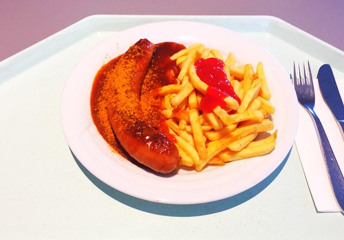 Fried curried sausage with french fries / Currywurst mit Pommes Frites