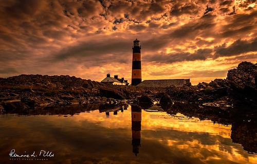 early light morning sunrise dawn cloudy sky rock pool reflection lighthouse black yellow stripes st johns point rossglass killough county down northern ireland