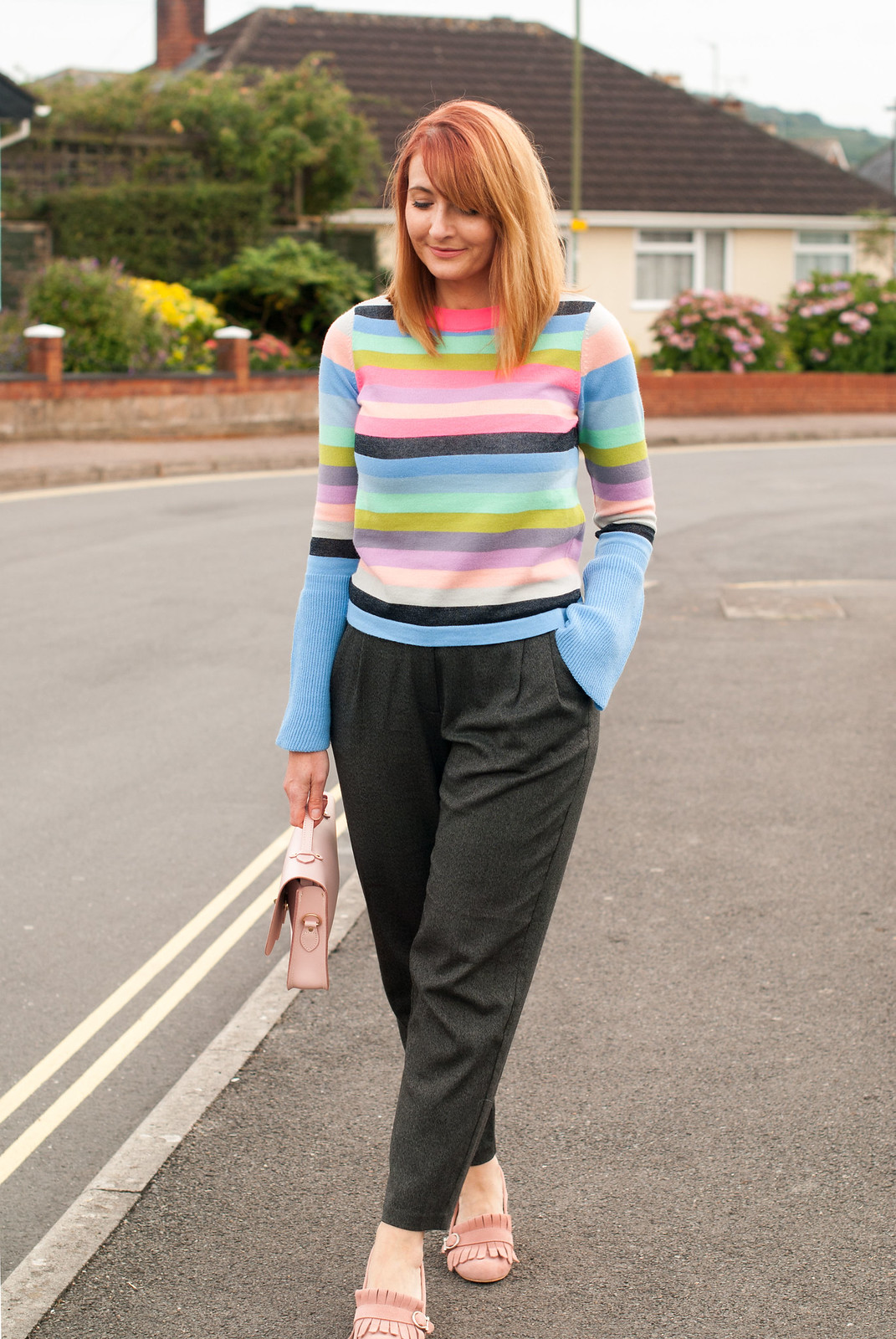 Bright autumnal outfit: Multi-coloured stripe sweater with fluted sleeves grey peg trousers pink suede block heel fringed shoes pink Cambridge Satchel Co Cloud satchel | Not Dressed As Lamb, over 40 style