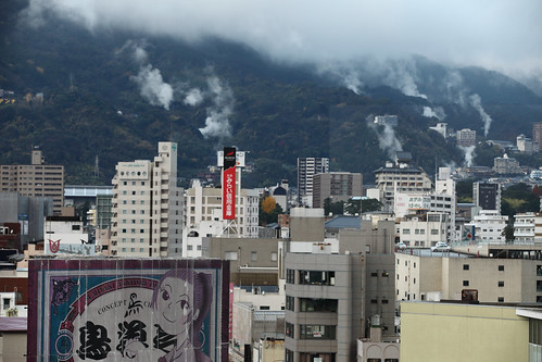 horizontal outdoors nopeople view city buildings houses hotels touristic resort dense japanese characters kanji sign advertisement board billboard depthoffield focusinforeground backgroundblur focus shallow steam gas mountain mist weather hotsprings onsen colour color jigoku beppuhells hotspring boilingwater geothermalactivity winter travel travelling december 2016 vacation canon 5dmkii camera photography oitaprefecture beppu spatown kyushu island japan asia