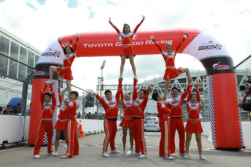 Cheerleaders Pumping Up The Spirit Of Racers And Spectators
