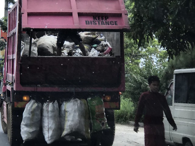 Garbage truck along STa. Road