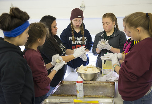 Sandy K Wilson, third from left, teaches campers how to make Indian fry bread. The bread was served as part of a full meal at the conclusion of the Harvest Camp.