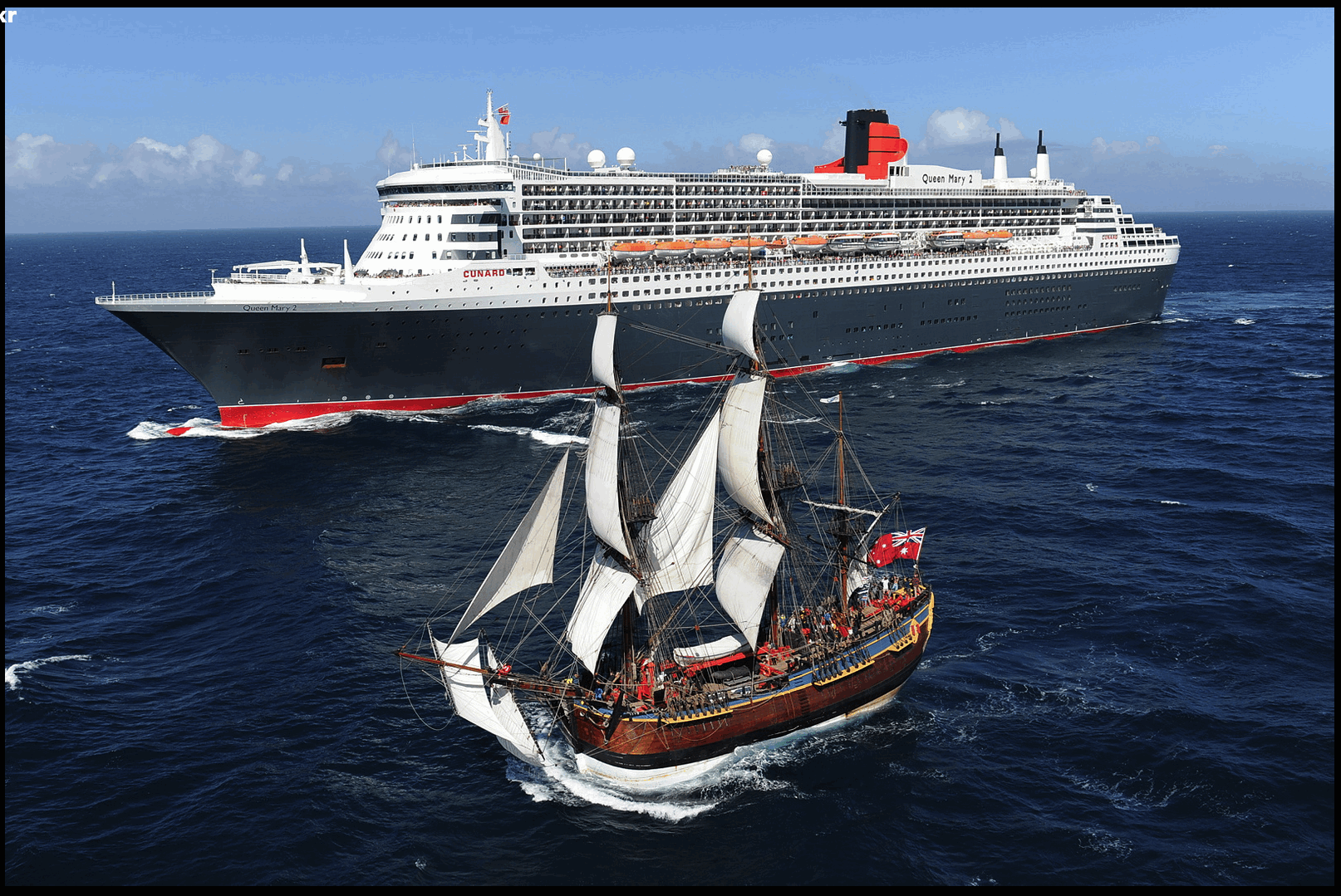 HMS Endeavour replica with RMS Queen Mary 2, 2013