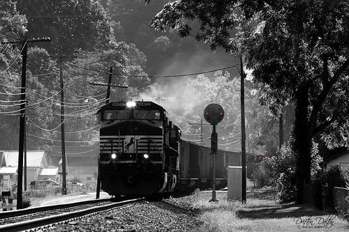 train trains locomotive locomotives railroad railway rail rails crossing road rural country coal freight ns norfolksouthern norfolk southern richlands va virginia tazewell county mountain mountains black blackandwhite white bw selective color lights signals cpl