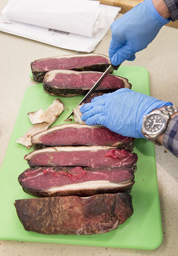 Andy Ellestad slices steaks from previously aged beef during a presentation on how to prepare the delicacy.