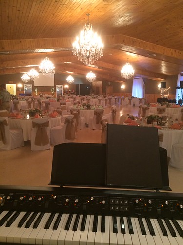 piano keyboard wedding reception hall chandelier tables tablecloth table keys keyboards pianos