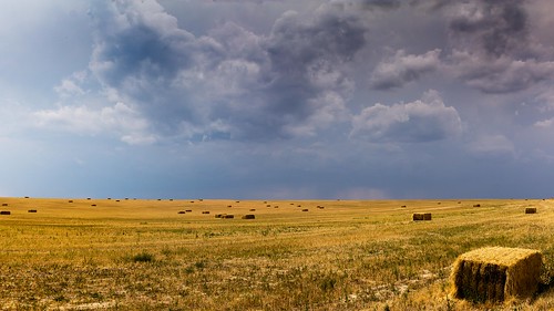 highplains easterncolorado colorado haybales hay storm clouds sky field