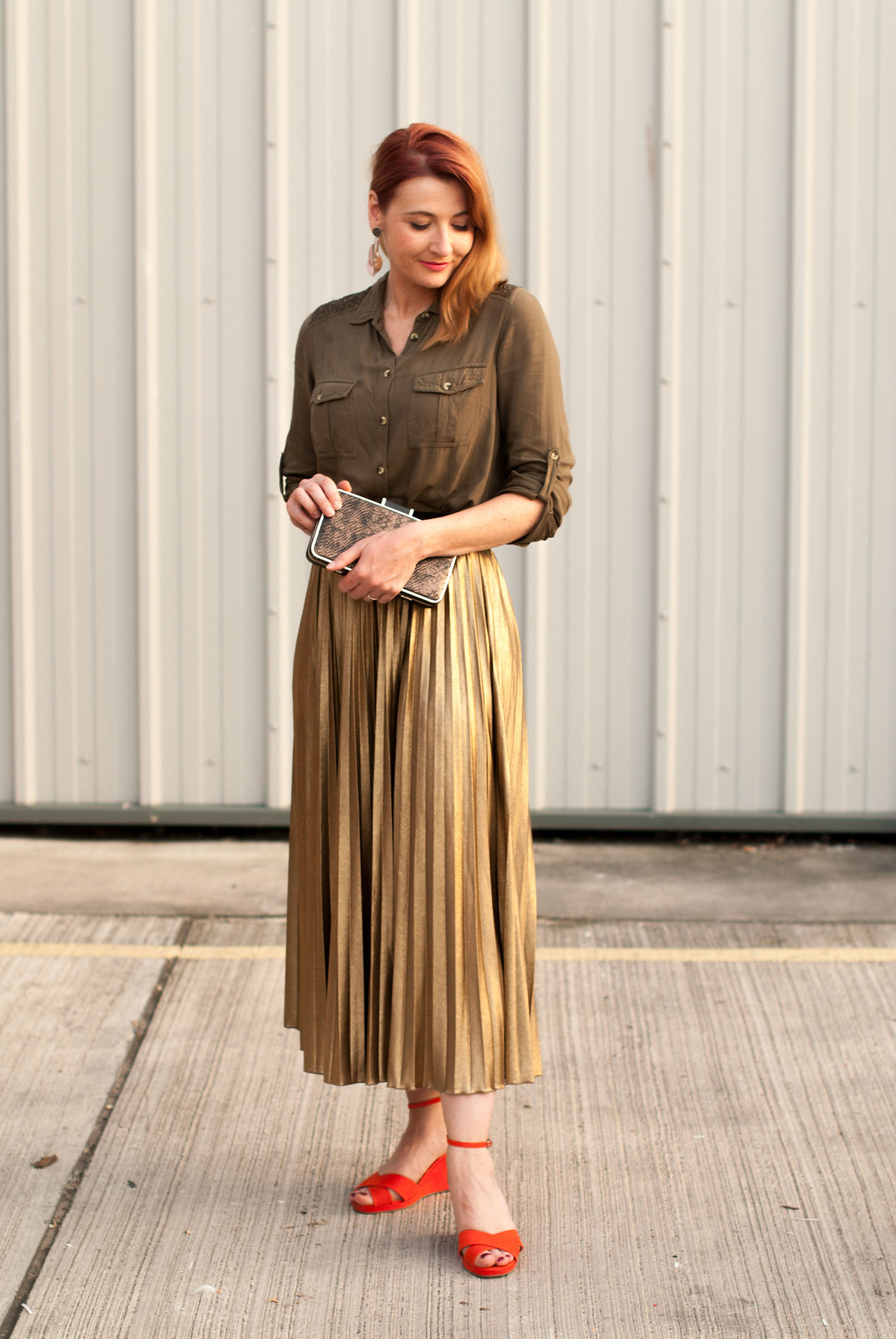 Date night outfit: Khaki soft shirt with embellished shoulders metallic gold pleated maxi skirt | orange-red wedge sandals metallic box clutch bag | Not Dressed As Lamb, over 40 style