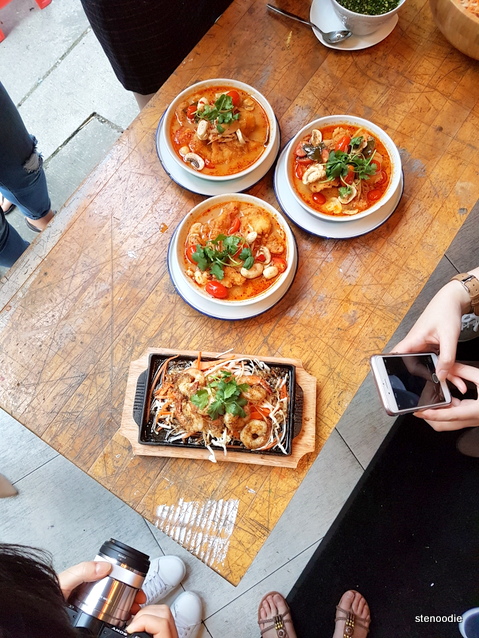  Tom yum soup and shrimp being photographed
