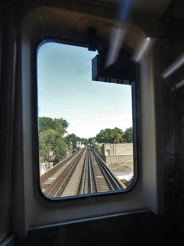 chicago elevatedtrain el transporation train urban sky trees railcar tracks glass window