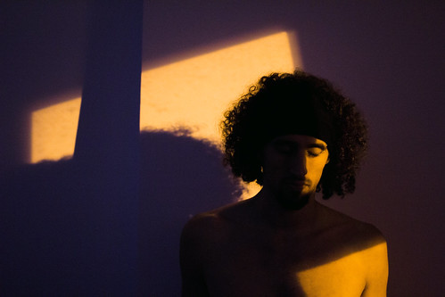portrait people person boy night light sunset artificial naked body hair curly black white blue yellow orange shadow shadows wall color colorful canon eos 60d 50mm sad depression depressed face eye eyes eyebrows piercing feel feeling cold winter leiria marinha grande portugal europe visit visitportugal anatomy skin art artistic artist nage andre gordalina november 2016 fire world