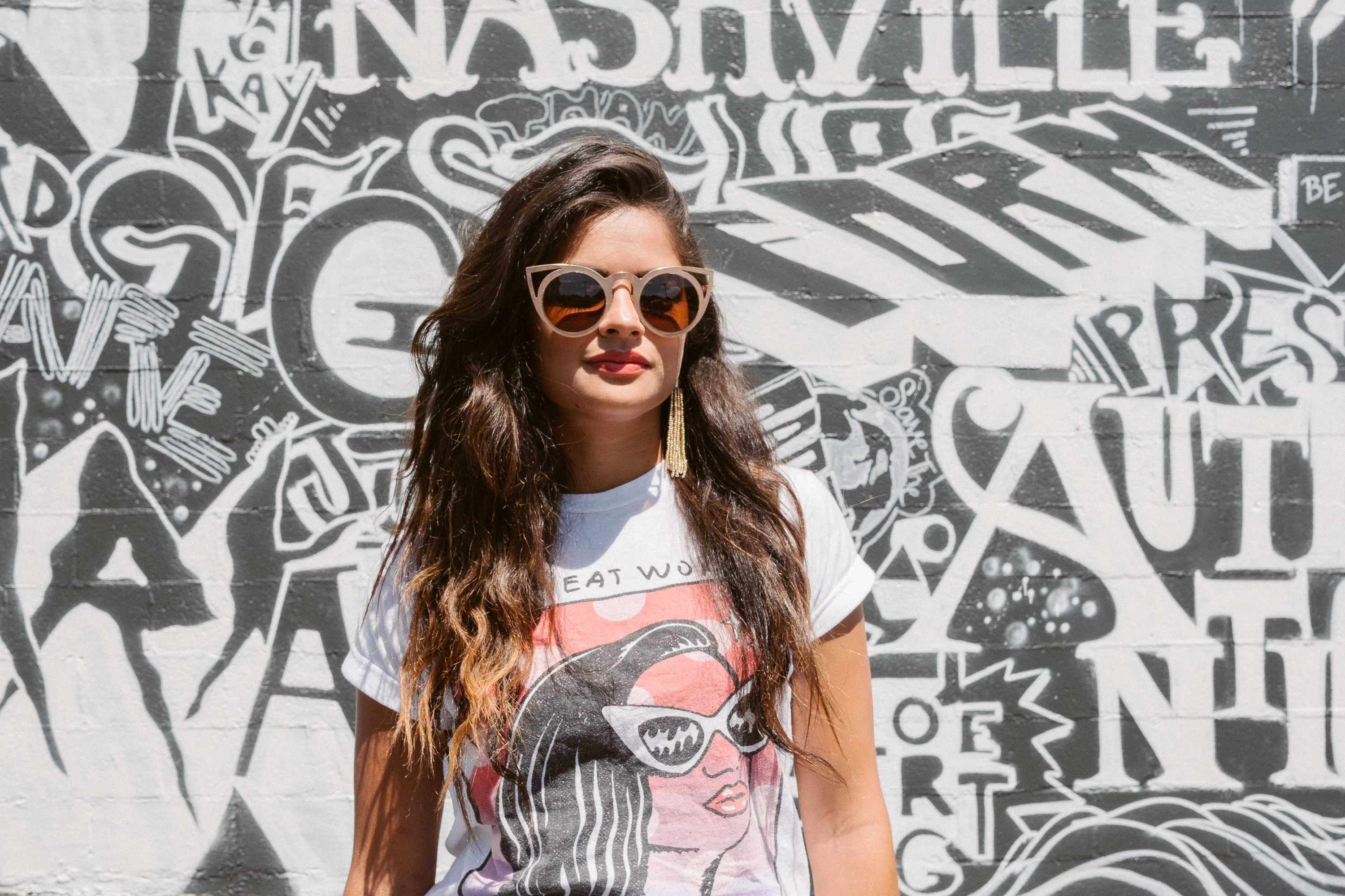 Nashville fashion blogger, Jimmy Eat World graphic tee, white color-blocked Summer outfit, gold beaded tassel earrings