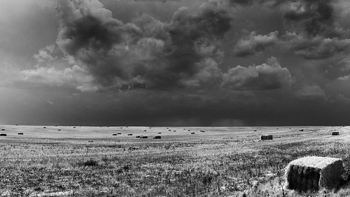 highplains easterncolorado colorado haybales hay field storm clouds sky blackandwhite monochrome