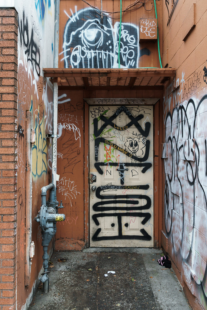 Graffiti covers a door and walls in Portland, Oregon
