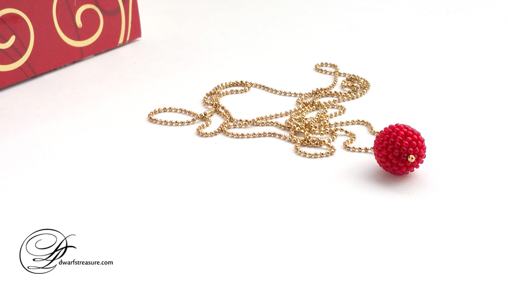 Bohemian long necklace with red and gold beaded ball charm