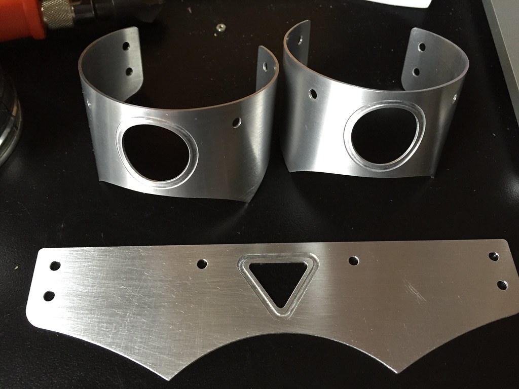 Flat aluminum parts rolled into rounded parts