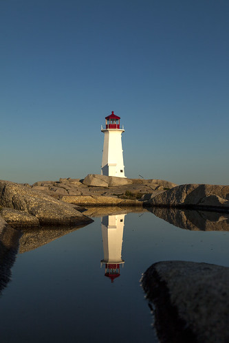 novascotia canada places peggyscove lighthouse morning light water reflection shadow