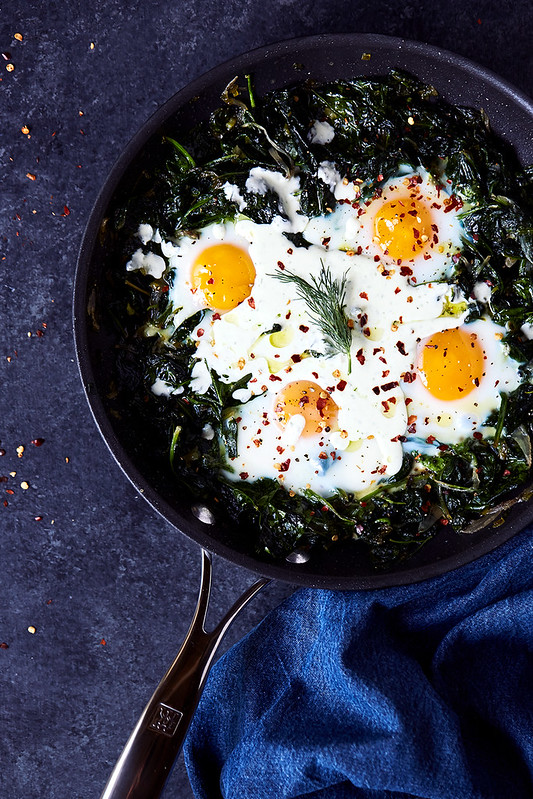 Skillet Baked Eggs and Greens with Herby Feta Yogurt Drizzle
