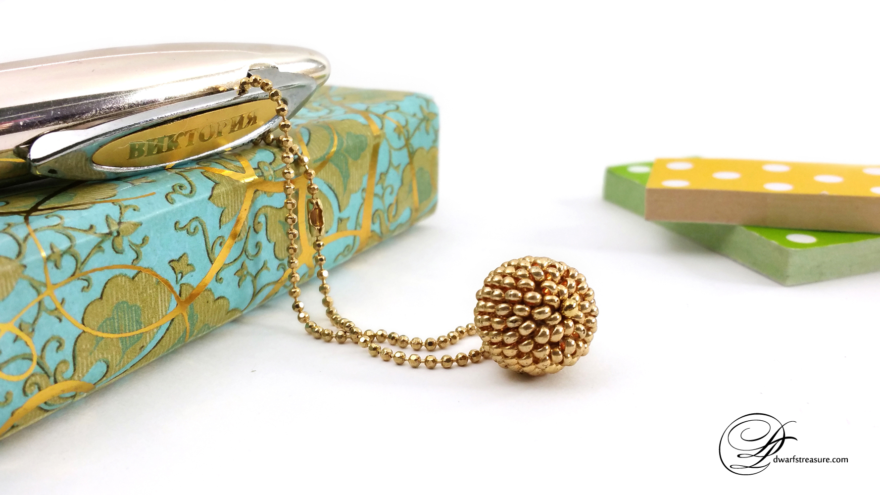 Adorable gold beaded ball charm