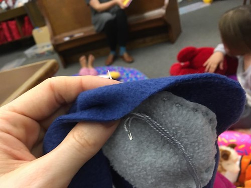 Stitching the spot onto Cat’s tail at LEGO club storytime.