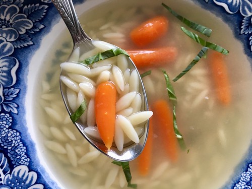 Homemade lazy orzo and carrot soup in chicken broth. EvinOK.com
