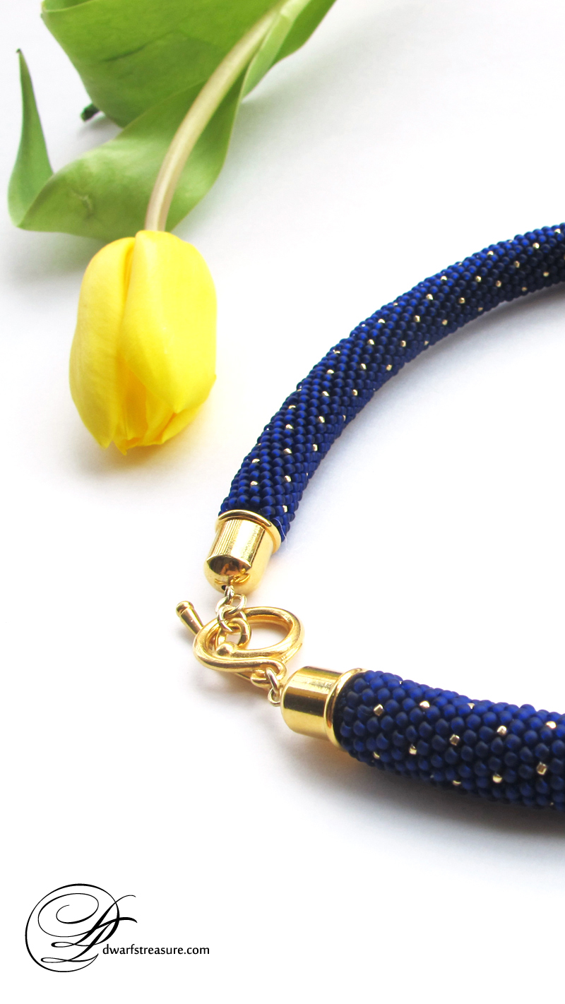 Graceful blue beaded glass statement necklace with gold sparks