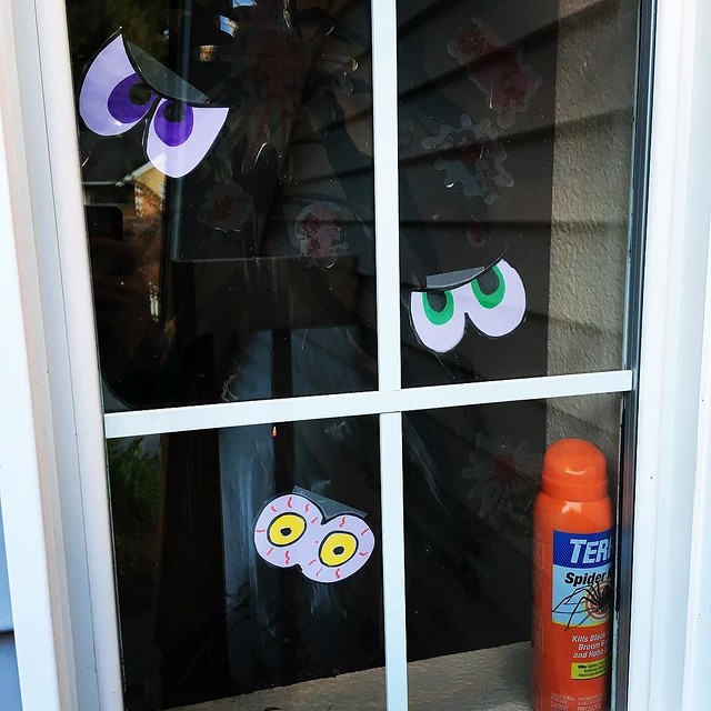 Googly eyes and blood spatters in the window. I kept the spider spray out too as an extra "spooky" touch