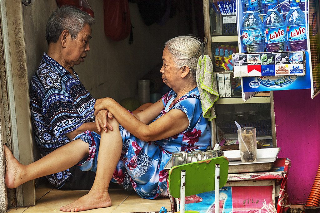 Old couple selling stuff--Hanoi