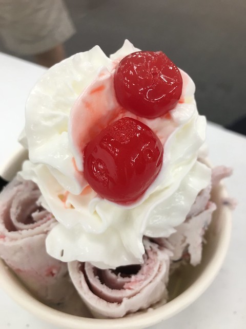 rolled ice cream with cherries and cream