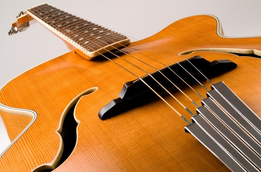 dramatic photo of archtop guitar